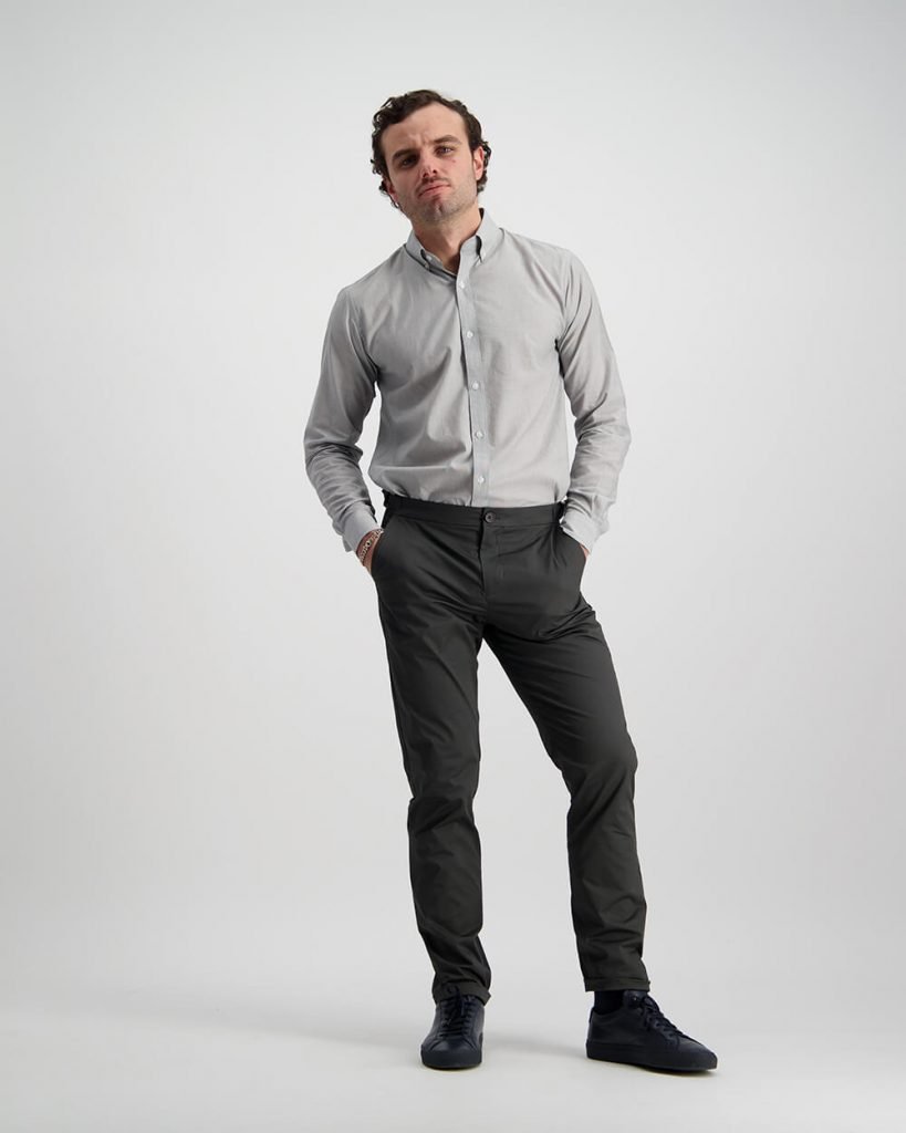 Male Model Photography wearing light grey dress shirt and dark grey pants.