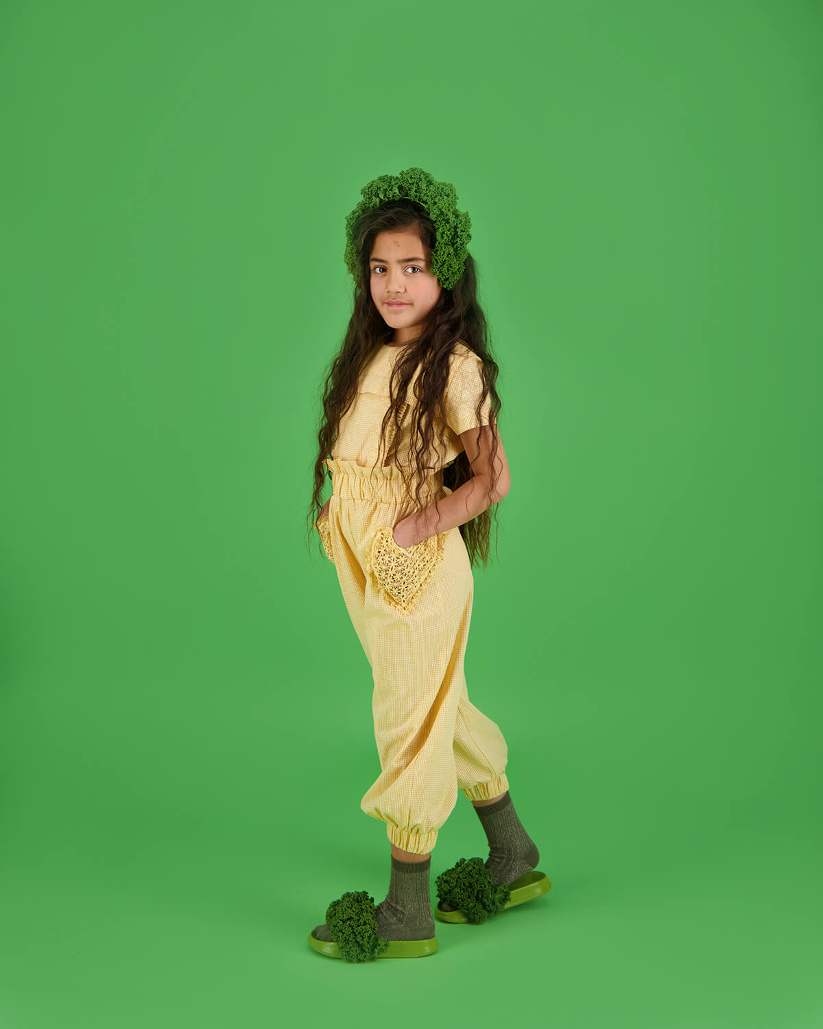 Carbon Soldier children's clothing on-model photoshoot creative with green background