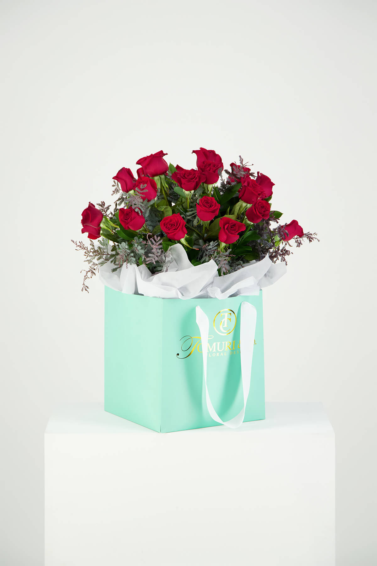 Beautiful red roses in blue box studio product photography and video