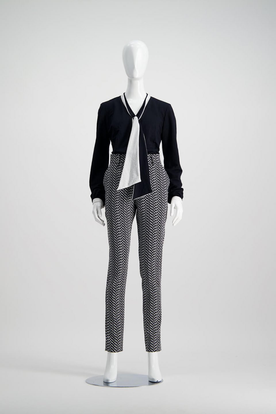 black shirt and checkered black and white pants from WORLD brand