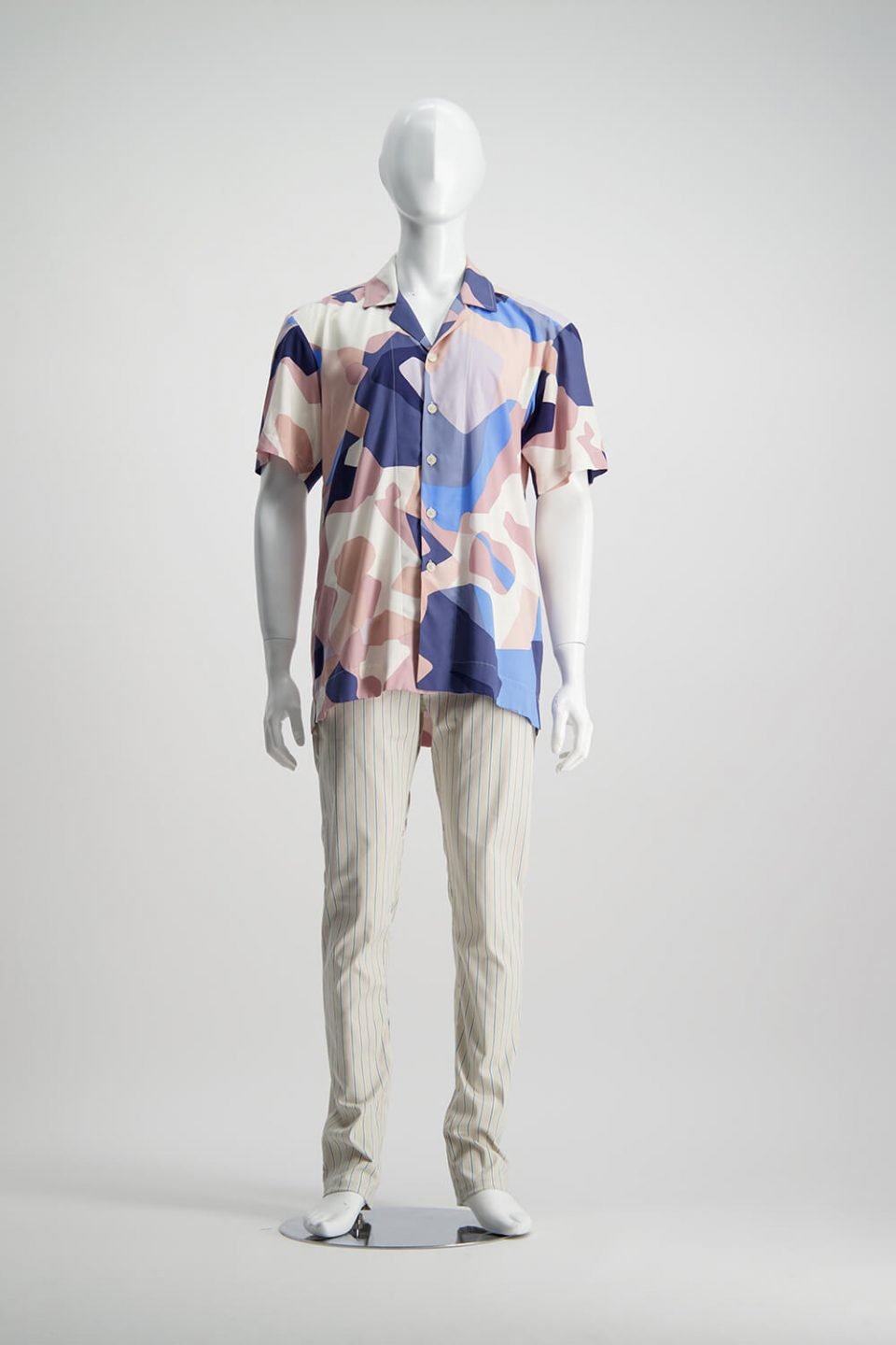 Multicoloured short-sleeved shirt untucked with loose fitting striped shorts from WORLD Brand