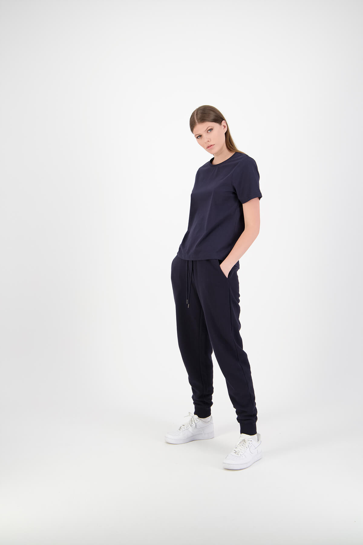 Huffer female model in studio wearing navy shirt