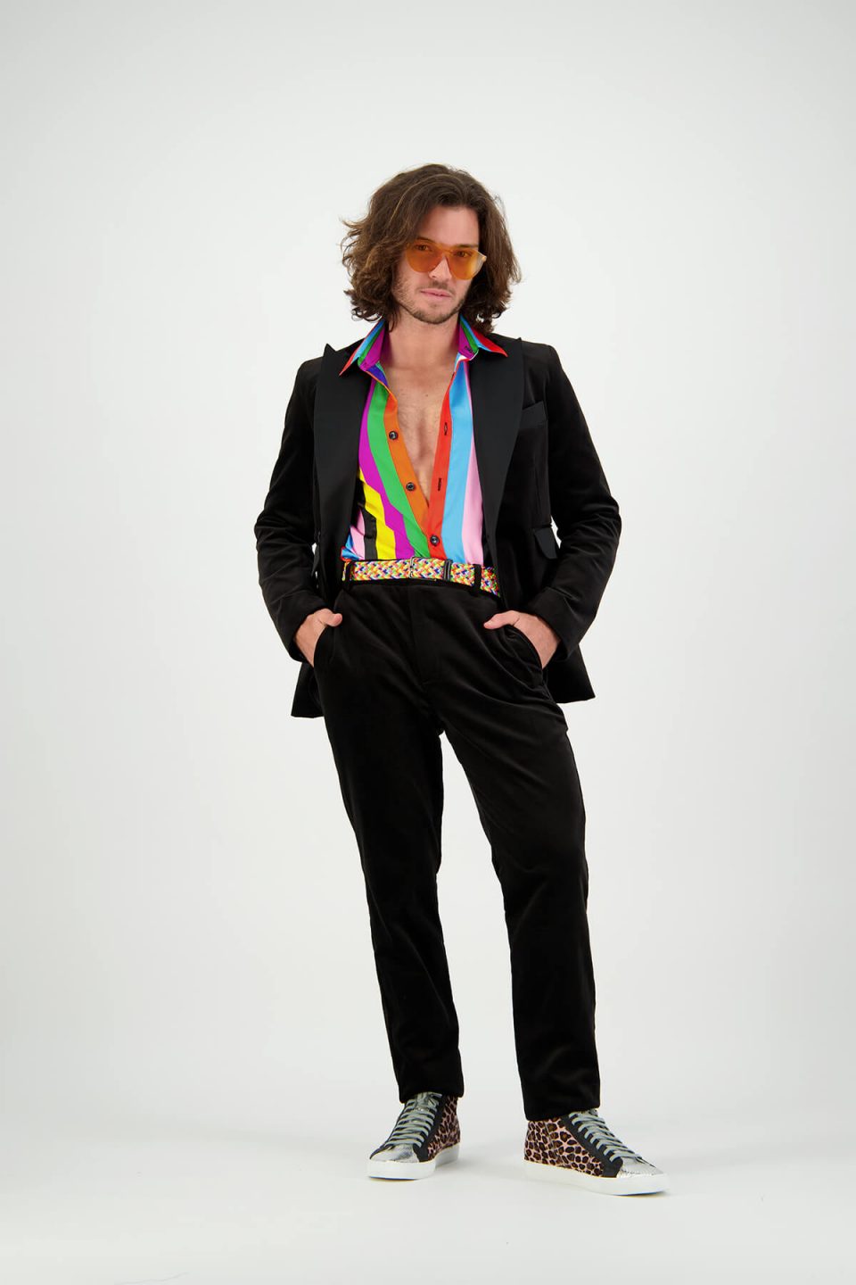 Male Fashion on-model photography in studio wearing striped shirt with black blazer and matching pants