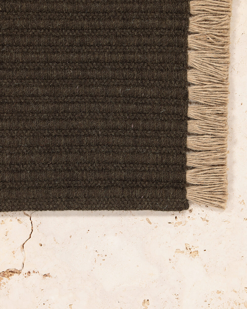 Tasseled Wool rug from Nodi rugs flat lay photograph