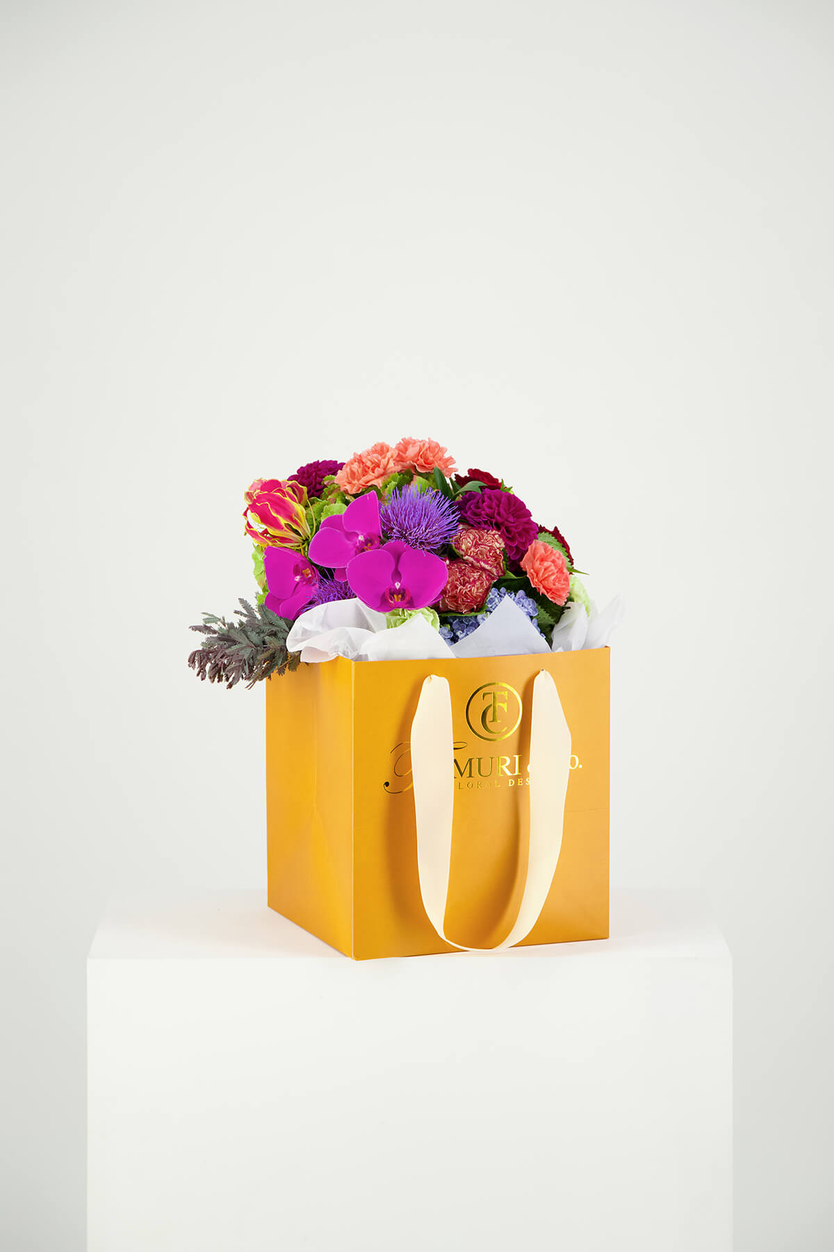 multicoloured fresh flower bunch photographed in a white studio